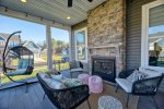 Large Screened-In Back Porch with Double Sided Natural Gas Fireplace 